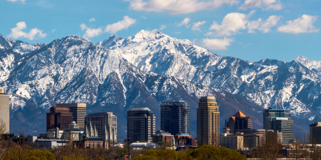 Salt Lake City skyline with snowy mountains as backdrop