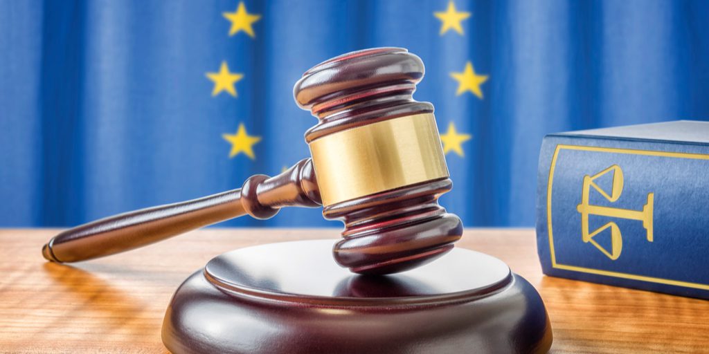 closeup of gavel with European union flag in backdrop