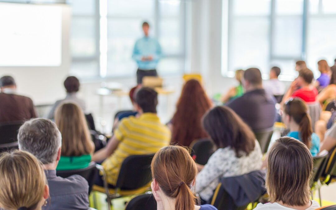 classroom of adults listening to public speaker